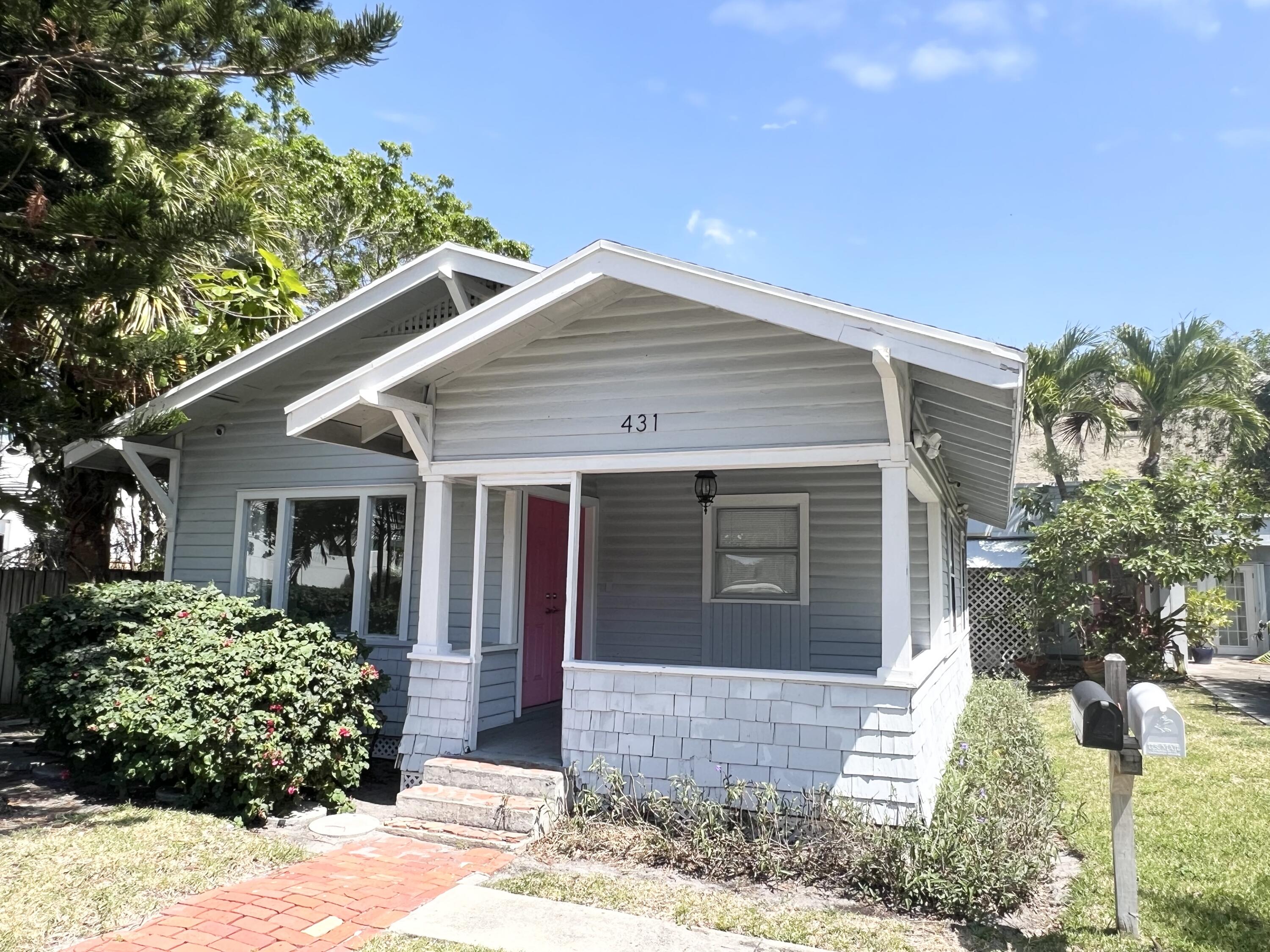 431 Ardmore Road West Palm Beach, FL 33401 - Photo 1 of 13 a front view of a house with garden