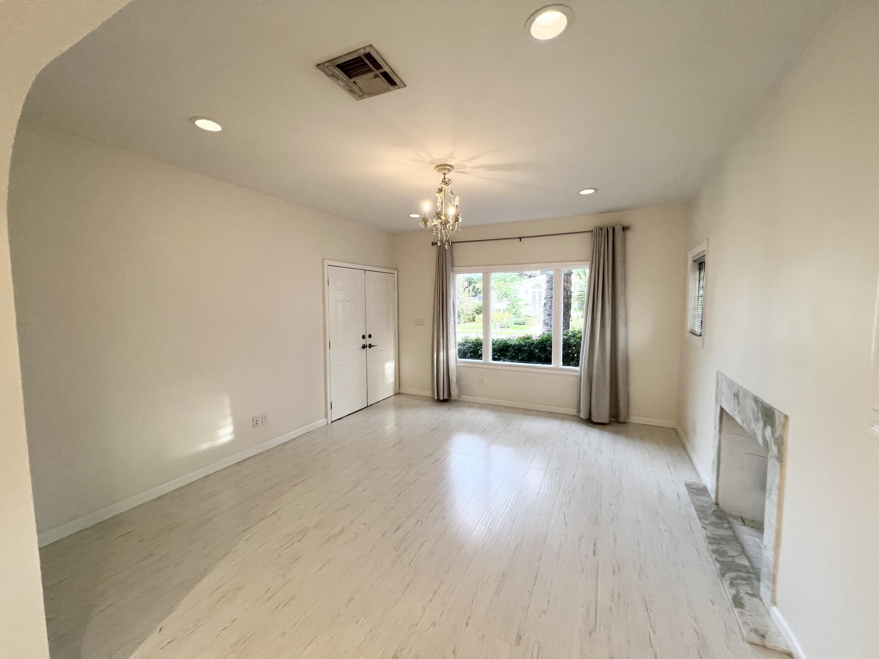 431 Ardmore Road West Palm Beach, FL 33401 - Photo 4 of 13 wooden floor in an empty room with a window