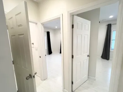 a bathroom with a tub and a shower