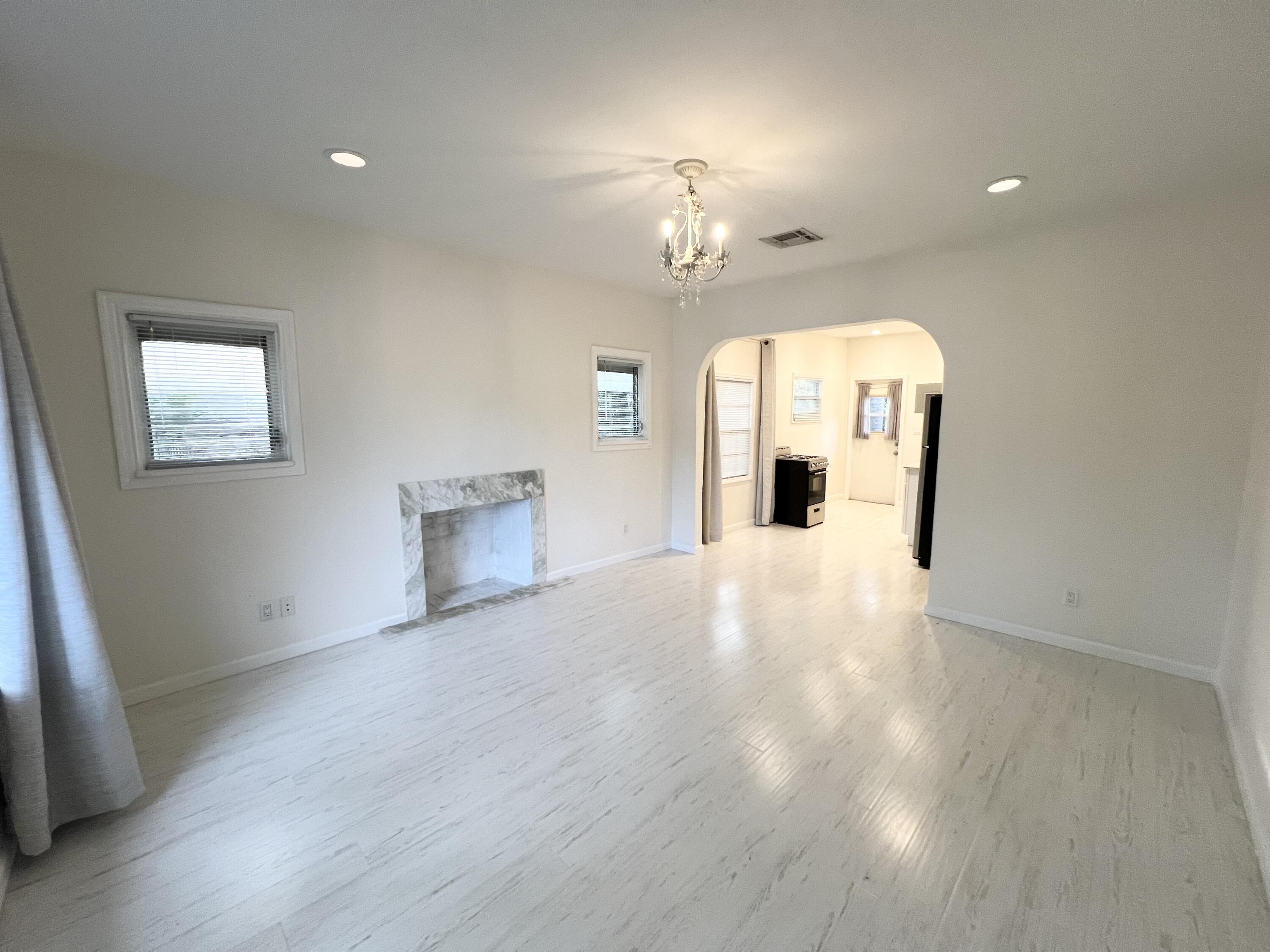 431 Ardmore Road West Palm Beach, FL 33401 - Photo 6 of 13 a view of a livingroom with a chandelier furniture and a window