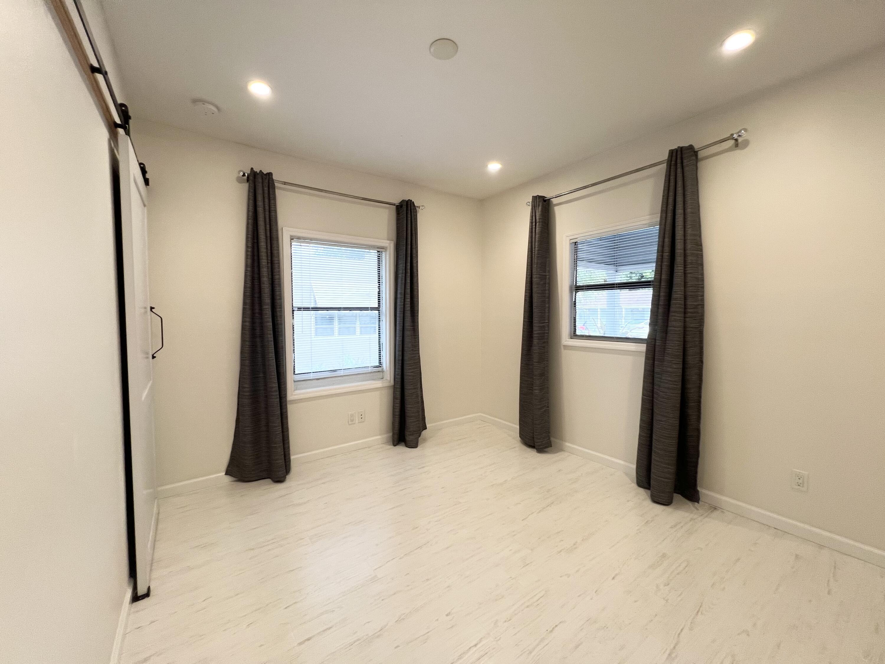 431 Ardmore Road West Palm Beach, FL 33401 - Photo 8 of 13 a big room with closet and mirror