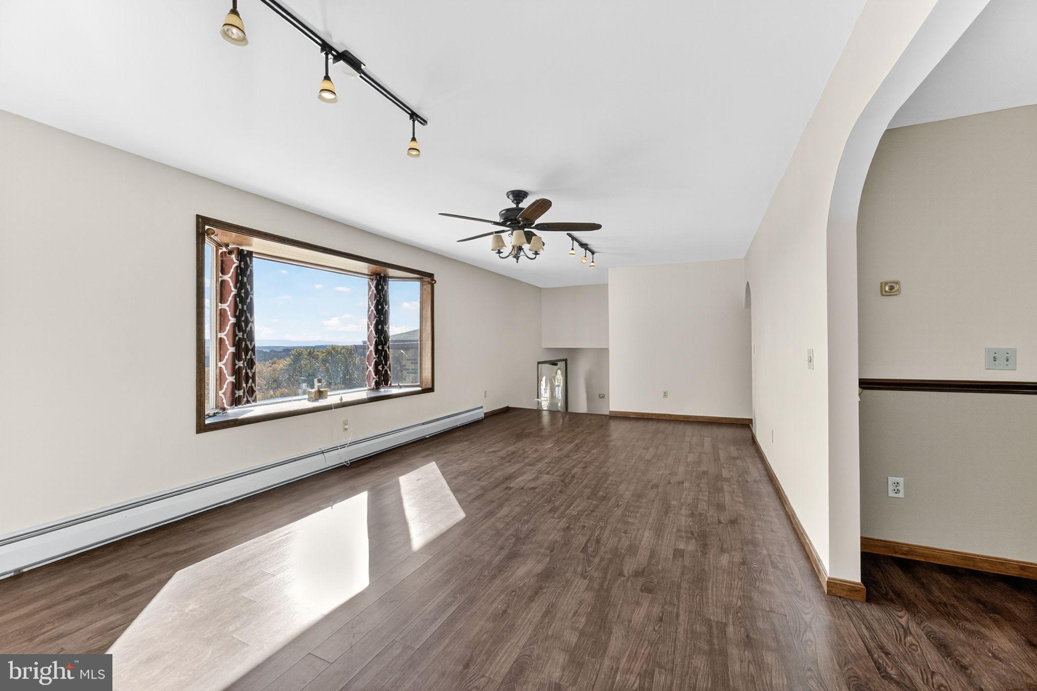 394 Flagstaff Road Lehighton, PA 18235 - Photo 14 of 73 a view of an empty room with wooden floor and a window
