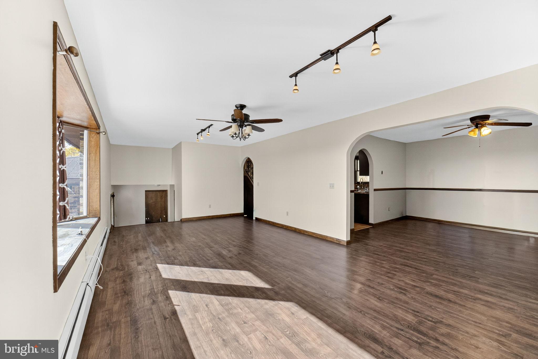 394 Flagstaff Road Lehighton, PA 18235 - Photo 15 of 73 a view of a livingroom with wooden floor and a ceiling fan