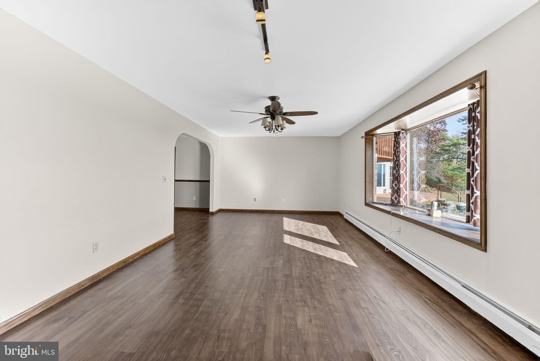 394 Flagstaff Road Lehighton, PA 18235 - Photo 16 of 73 a view of an empty room with wooden floor and a window