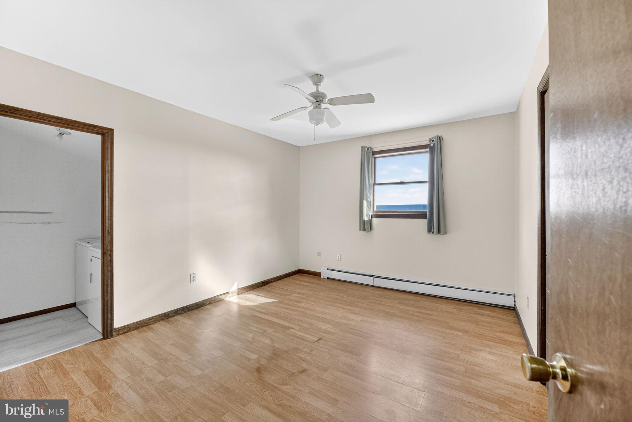 394 Flagstaff Road Lehighton, PA 18235 - Photo 21 of 73 an empty room with windows and fan