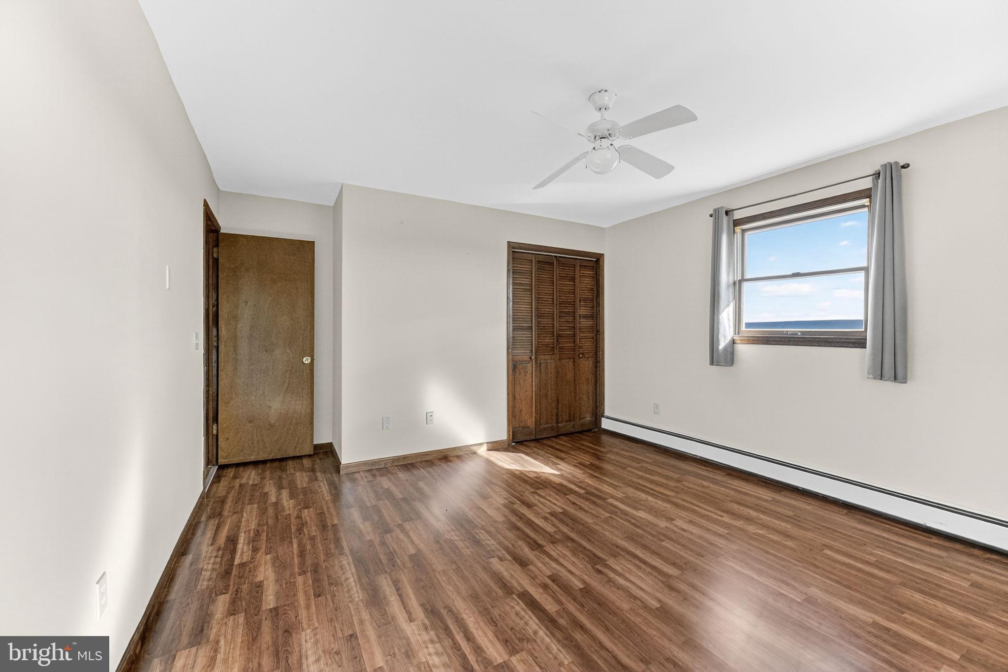 394 Flagstaff Road Lehighton, PA 18235 - Photo 24 of 73 a view of an empty room with wooden floor and a window