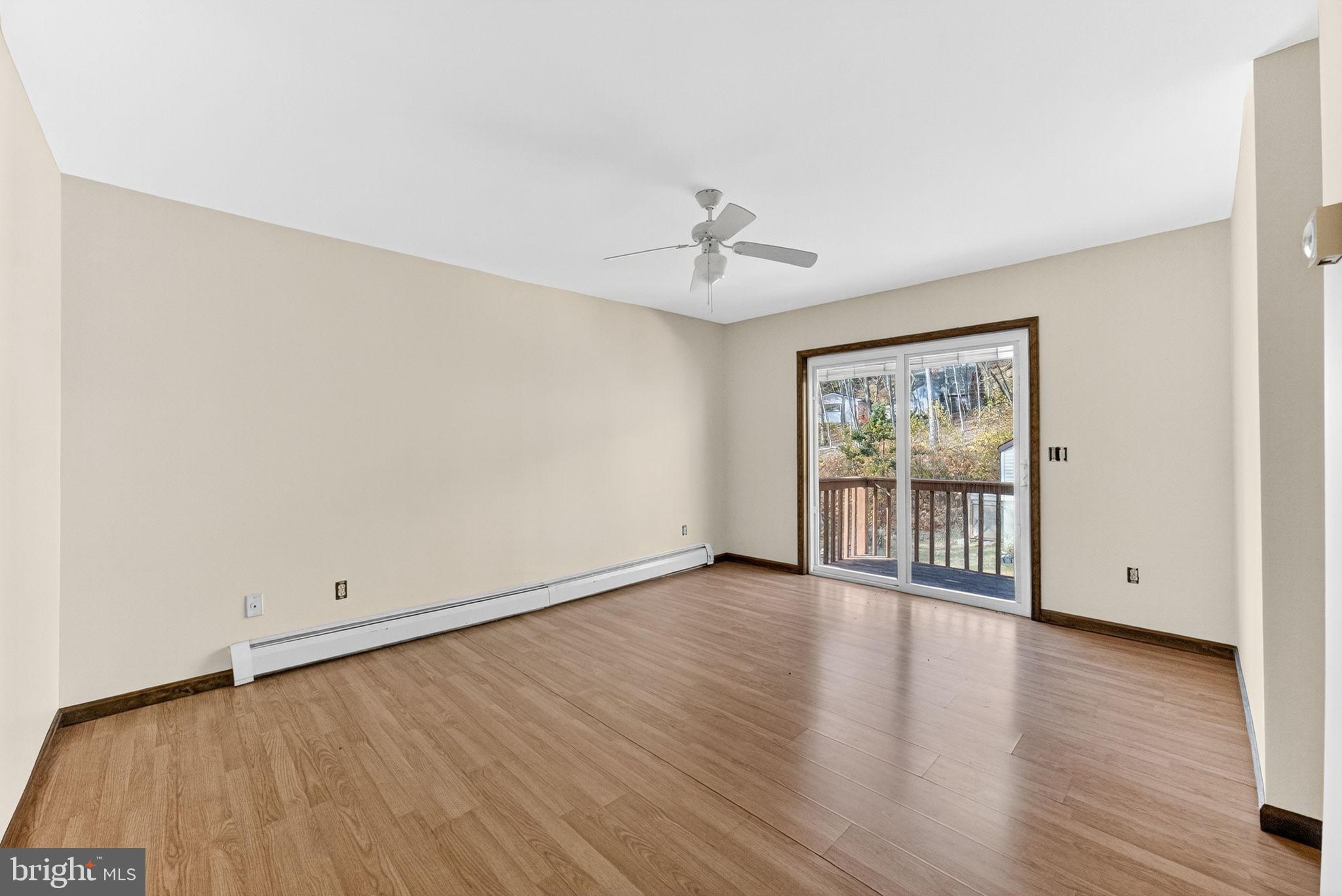 394 Flagstaff Road Lehighton, PA 18235 - Photo 25 of 73 a view of an empty room with wooden floor and a window
