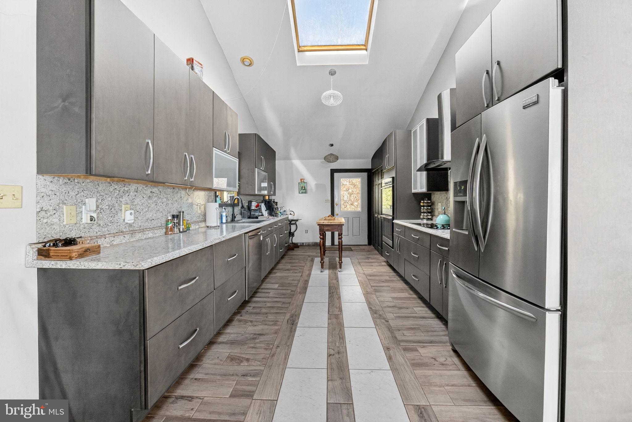 394 Flagstaff Road Lehighton, PA 18235 - Photo 37 of 73 a kitchen with stainless steel appliances a refrigerator sink and cabinets