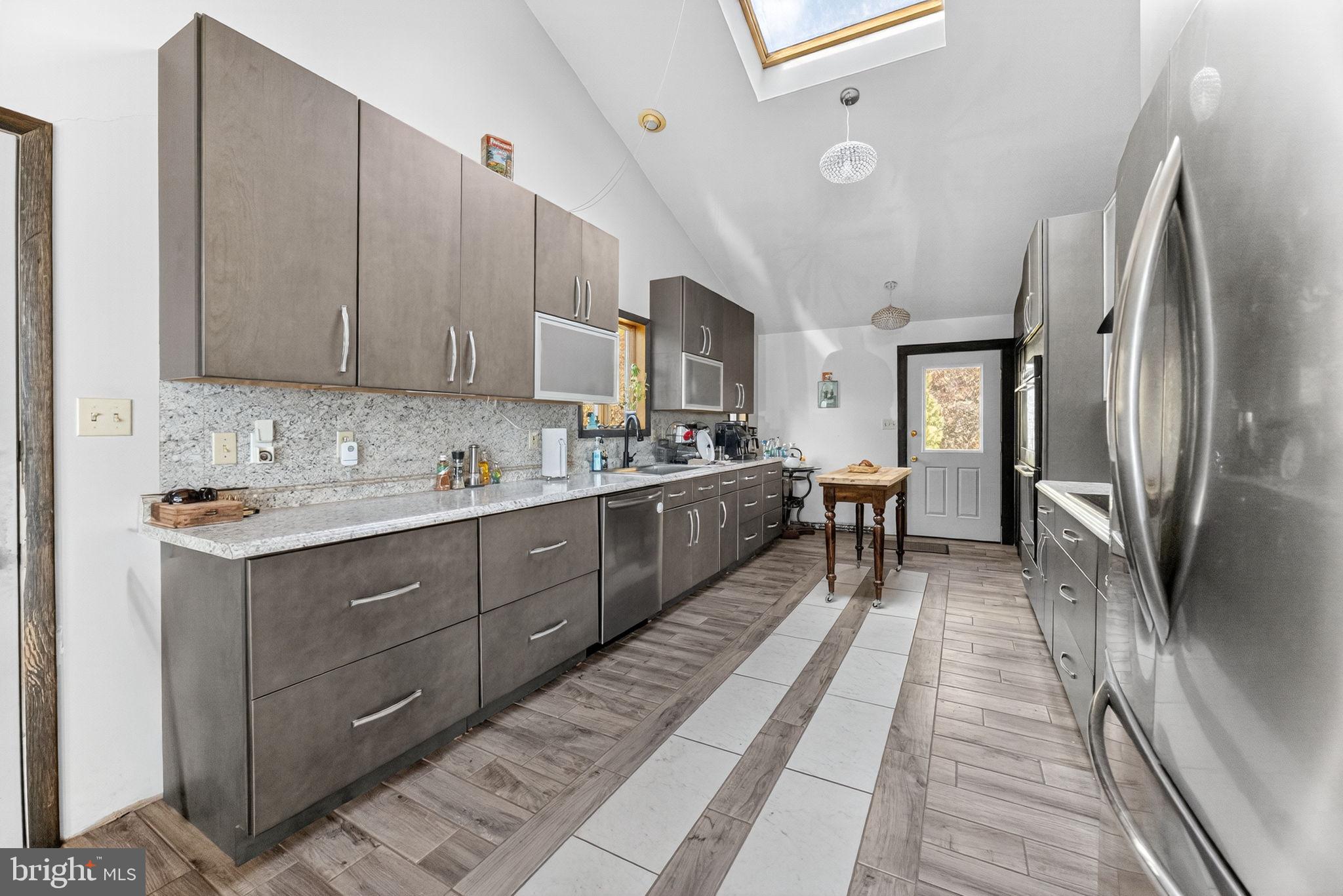 394 Flagstaff Road Lehighton, PA 18235 - Photo 38 of 73 a kitchen with stainless steel appliances granite countertop a sink refrigerator and cabinets