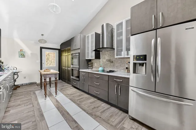 a white toilet sitting next to a small window