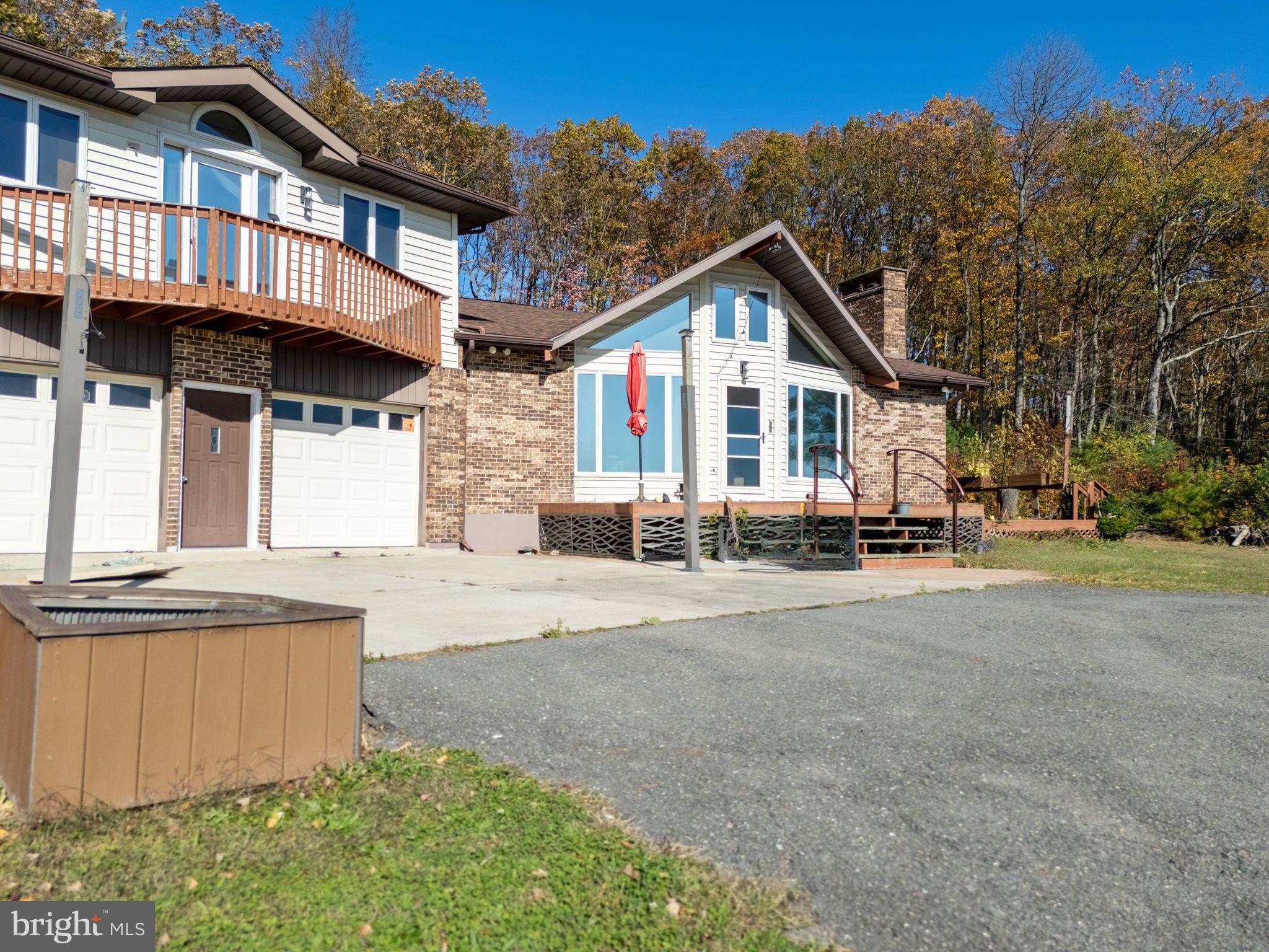 394 Flagstaff Road Lehighton, PA 18235 - Photo 4 of 73 a view of a house with a yard and large trees