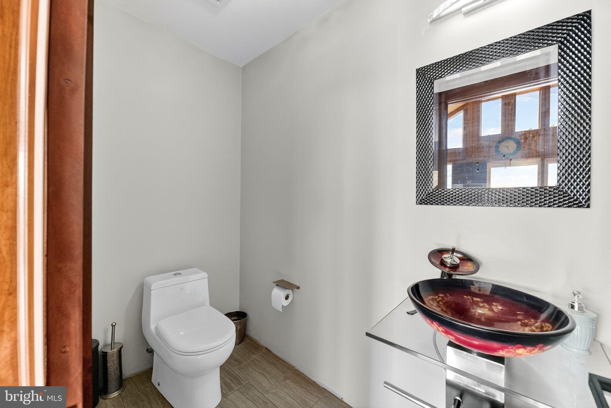 394 Flagstaff Road Lehighton, PA 18235 - Photo 42 of 73 a bathroom with a toilet a sink and a window
