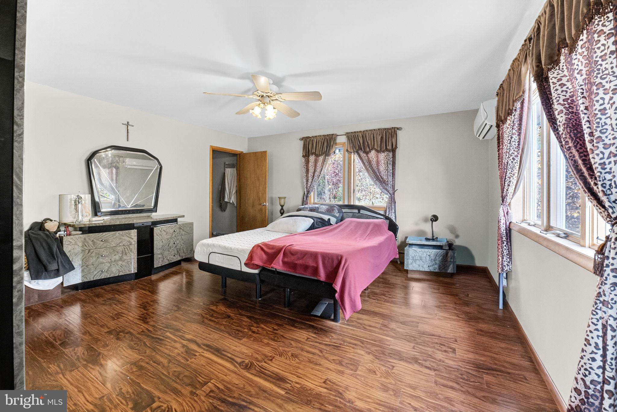 394 Flagstaff Road Lehighton, PA 18235 - Photo 45 of 73 a spacious bedroom with a bed a chandelier with dresser and mirror