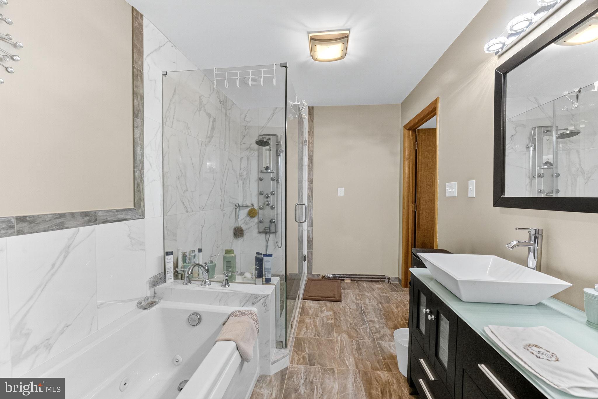 394 Flagstaff Road Lehighton, PA 18235 - Photo 48 of 73 a spacious bathroom with a granite countertop tub sink and mirror
