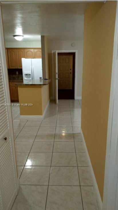 15620 Southwest 80th Street, Unit H107 Miami, FL 33193 - Photo 2 of 7 a bathroom with a sink and a mirror