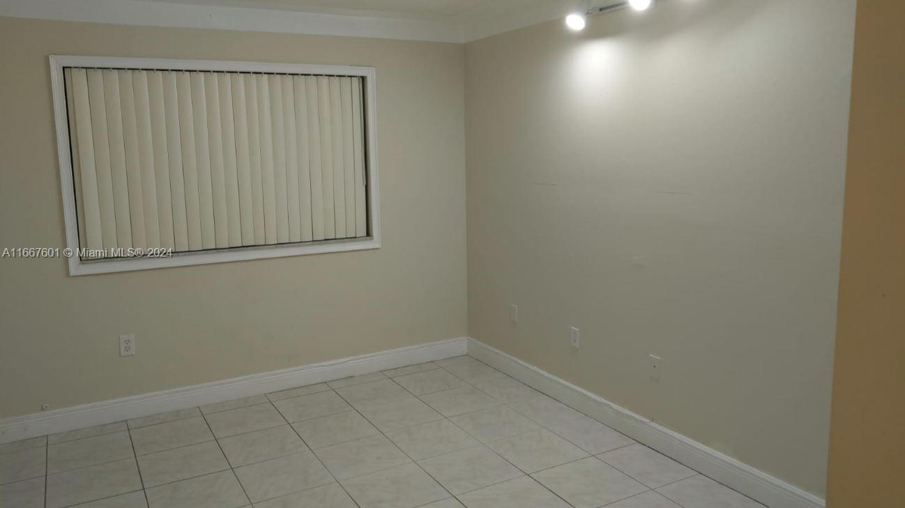 15620 Southwest 80th Street, Unit H107 Miami, FL 33193 - Photo 4 of 7 a view of an empty room