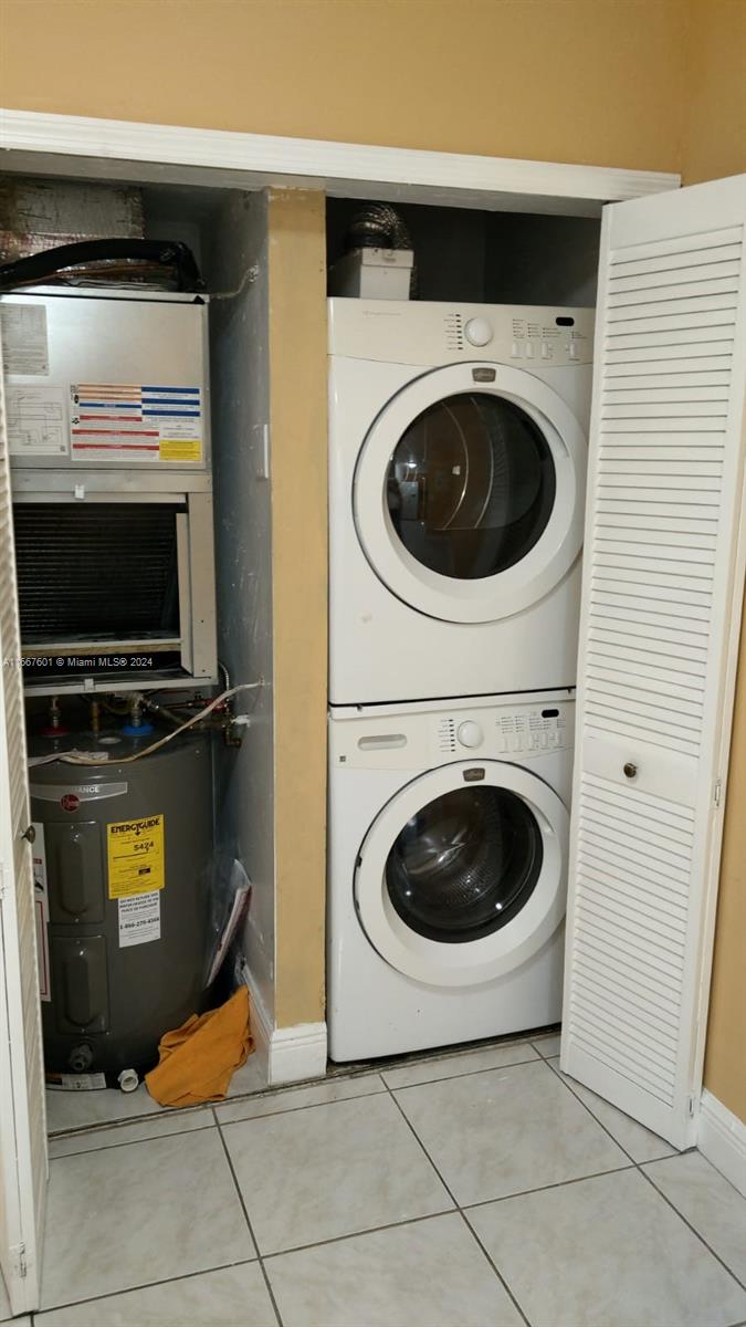 15620 Southwest 80th Street, Unit H107 Miami, FL 33193 - Photo 7 of 7 a utility room with dryer and washer