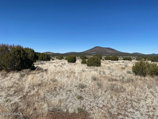 a view of mountain view with mountains in the background