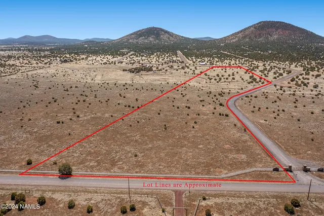 a view of mountain with a field