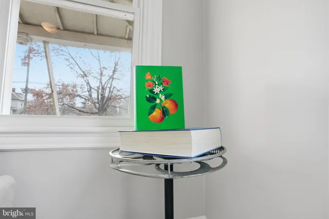 a kitchen with granite countertop a stove a sink and a microwave