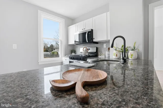a kitchen with stainless steel appliances a refrigerator stove and sink
