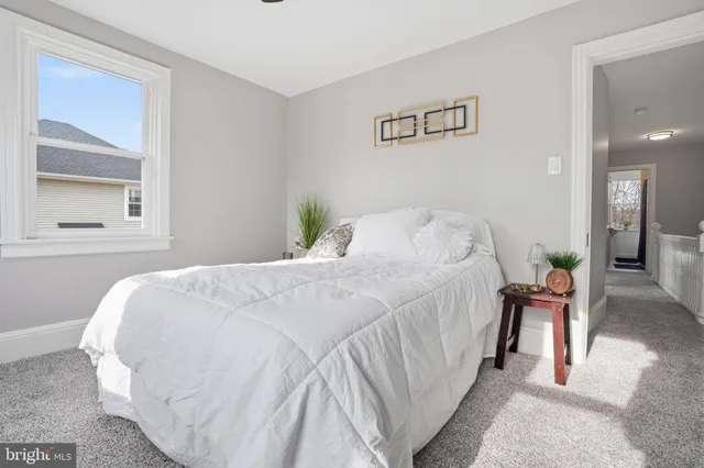 a bathroom with a sink a mirror and a window