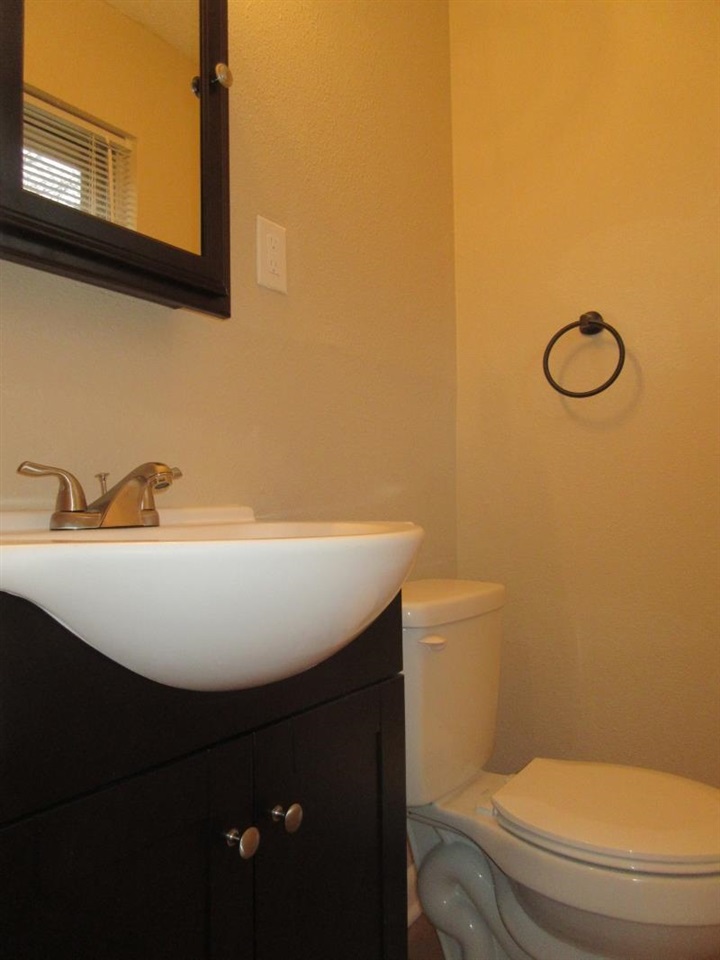 4324 Sidney Road Memphis, TN 38116 - Photo 5 of 8 a bathroom with a sink and a toilet
