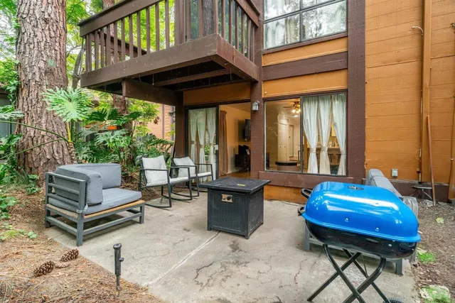 a backyard of a house with outdoor seating