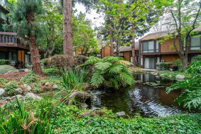 a backyard of a house with outdoor seating