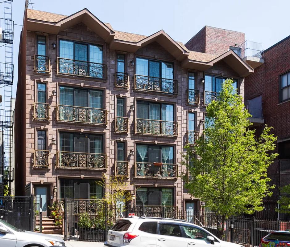 475 West 146th Street Manhattan, NY 10031 - Photo 1 of 19 a front view of a building with a garden and plants