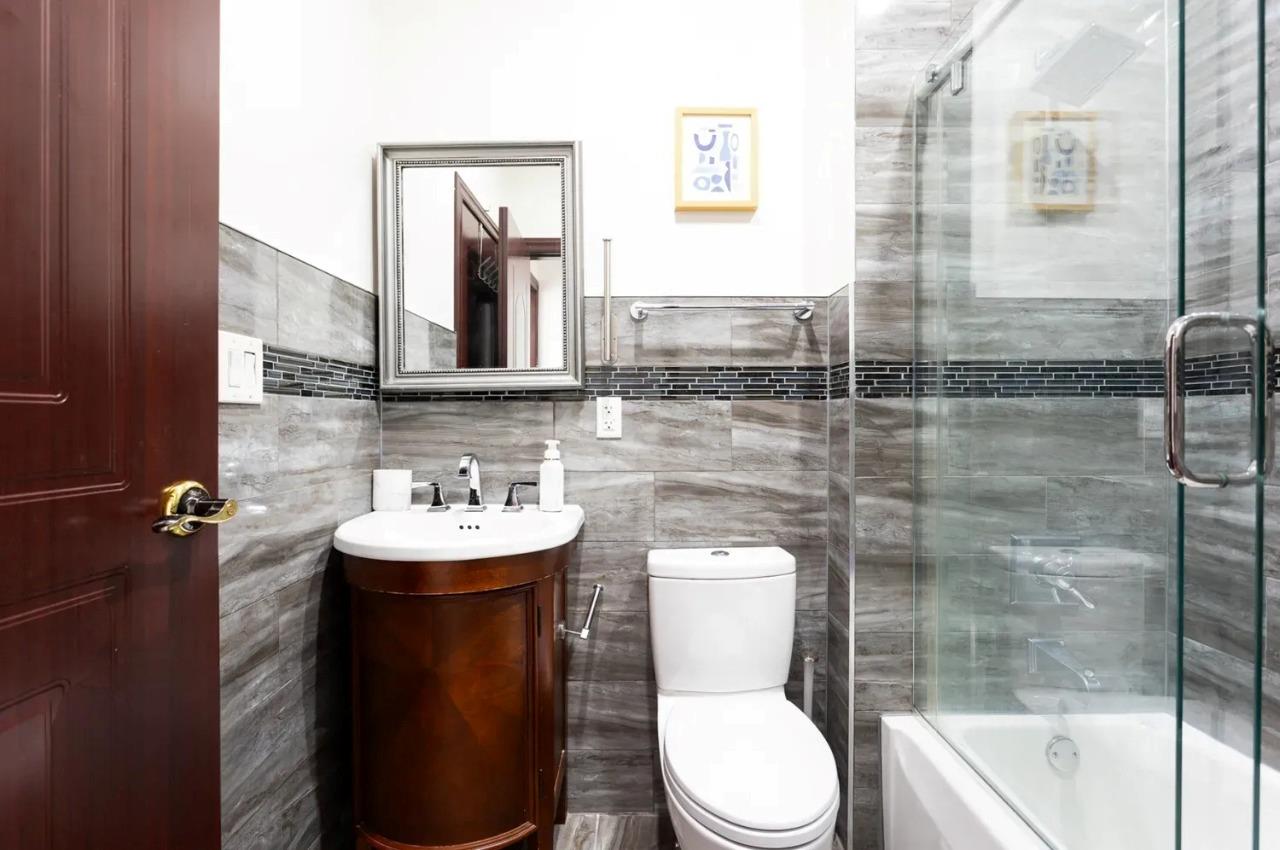 475 West 146th Street Manhattan, NY 10031 - Photo 13 of 19 a bathroom with a sink toilet and shower