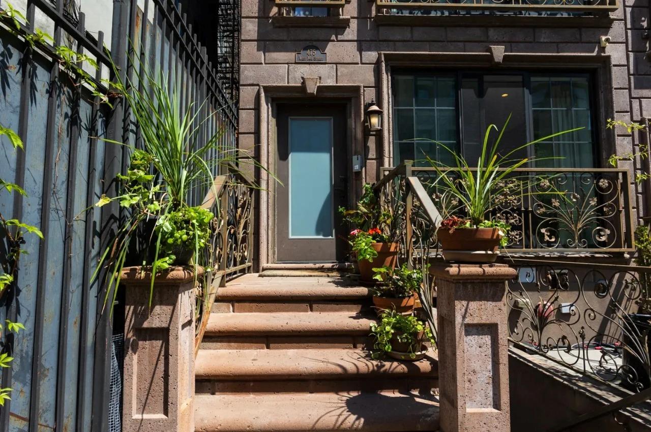 475 West 146th Street Manhattan, NY 10031 - Photo 2 of 19 a view of house with two potted plants