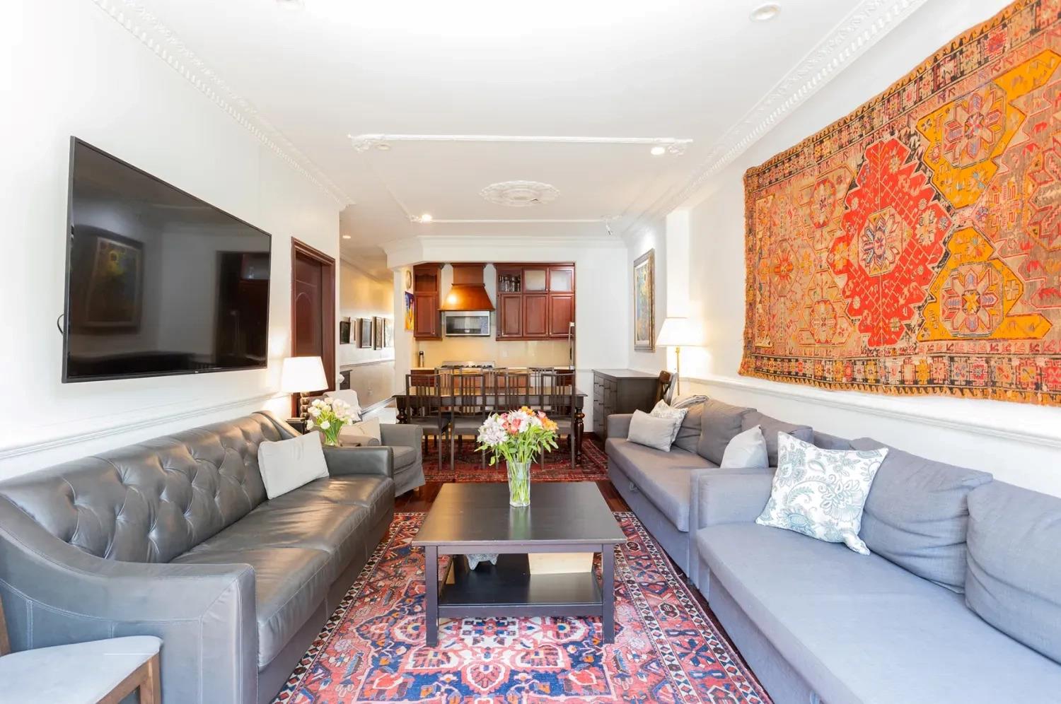 475 West 146th Street Manhattan, NY 10031 - Photo 8 of 19 a living room with furniture and a flat screen tv