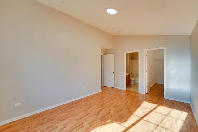 a view of a room with closet and wooden floor