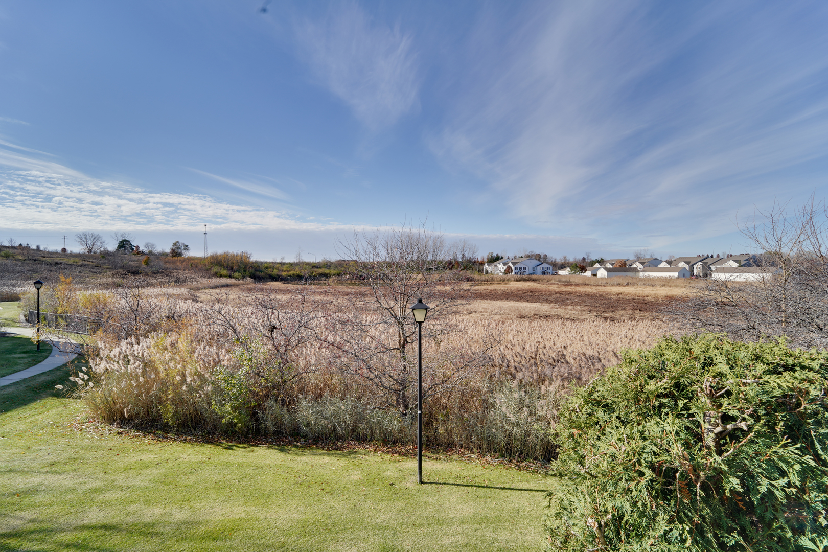 1231 Silverstone Drive, Unit 1231 Carpentersville, IL 60110 - Photo 22 of 22 a view of a lake with houses in the back