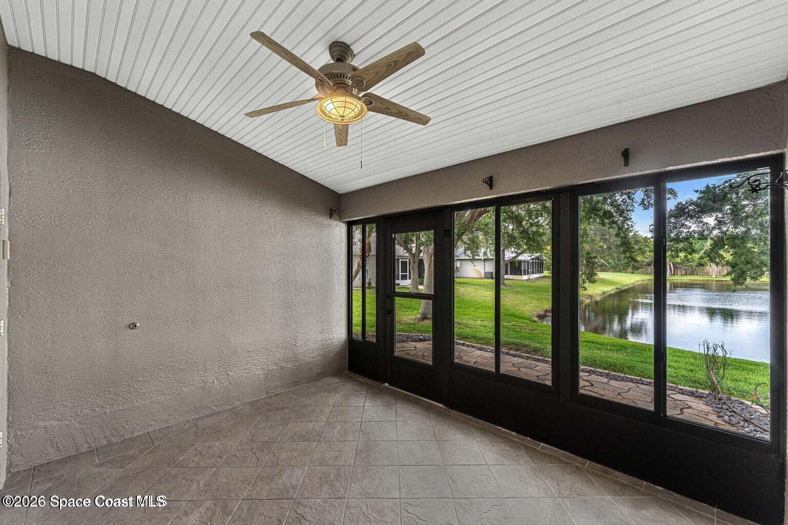 4741 Decatur Circle Melbourne, FL 32934 - Photo 26 of 44 a view of an empty room with a window