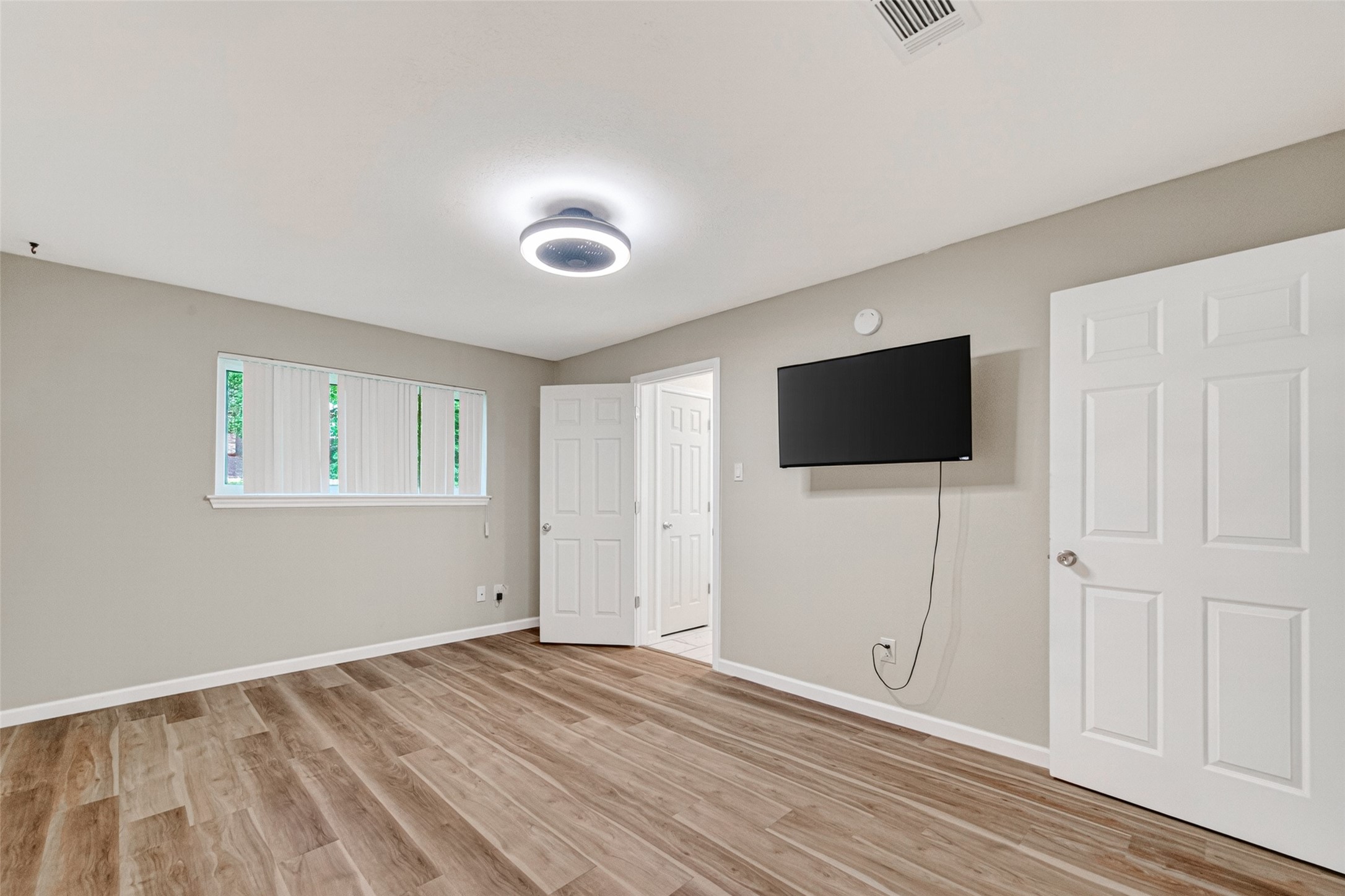 25503 Foxbriar Lane Spring, TX 77373 - Photo 33 of 45 a view of a livingroom with an empty space & wooden floor