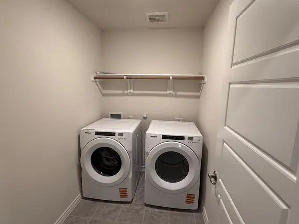 a view of a hallway with a kitchen