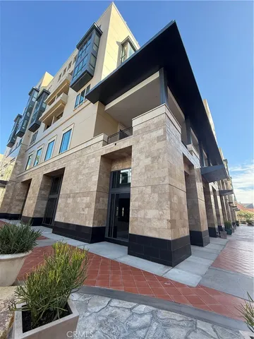 a kitchen with kitchen island a counter top space cabinets and stainless steel appliances