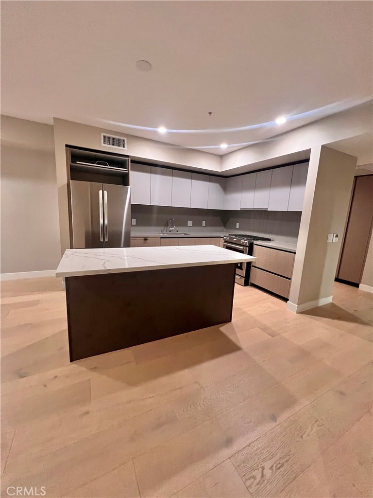 39 South Los Robles Avenue Pasadena, CA 91101 - Photo 6 of 36 a room with kitchen island sink and faucet