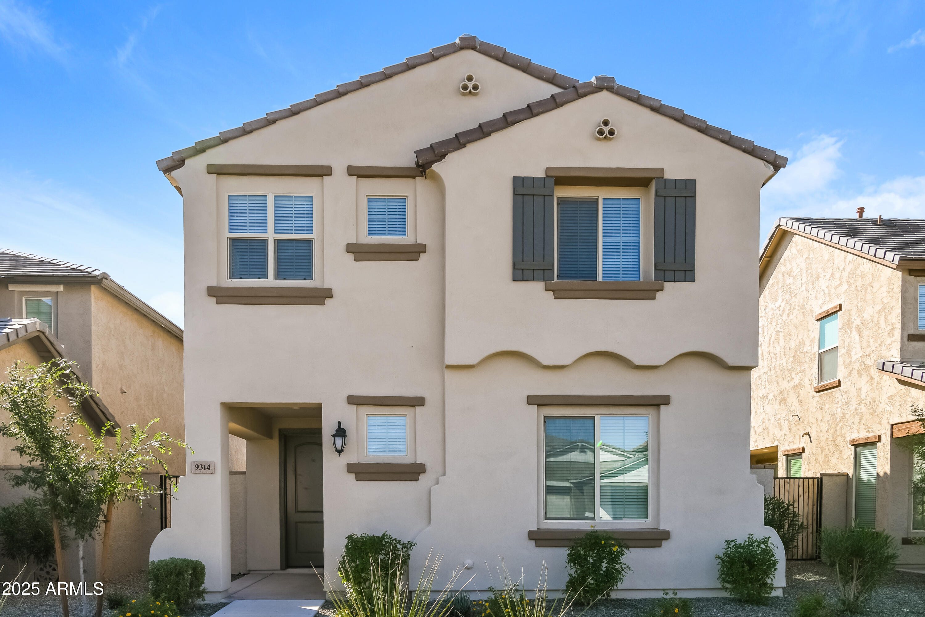 a front view of a house with a yard