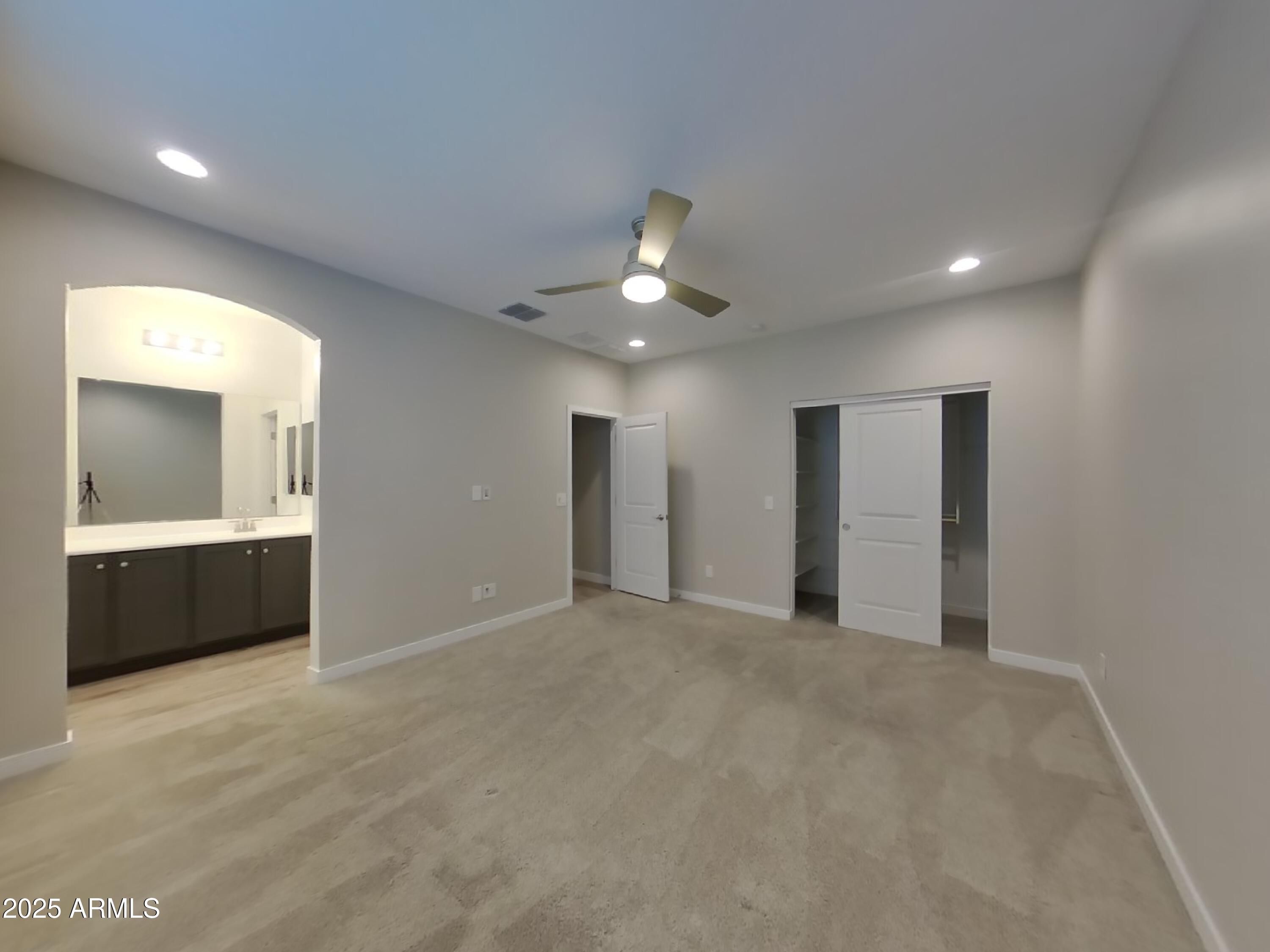 9314 East Strobe Avenue Mesa, AZ 85212 - Photo 10 of 27 a view of an empty room with a kitchen