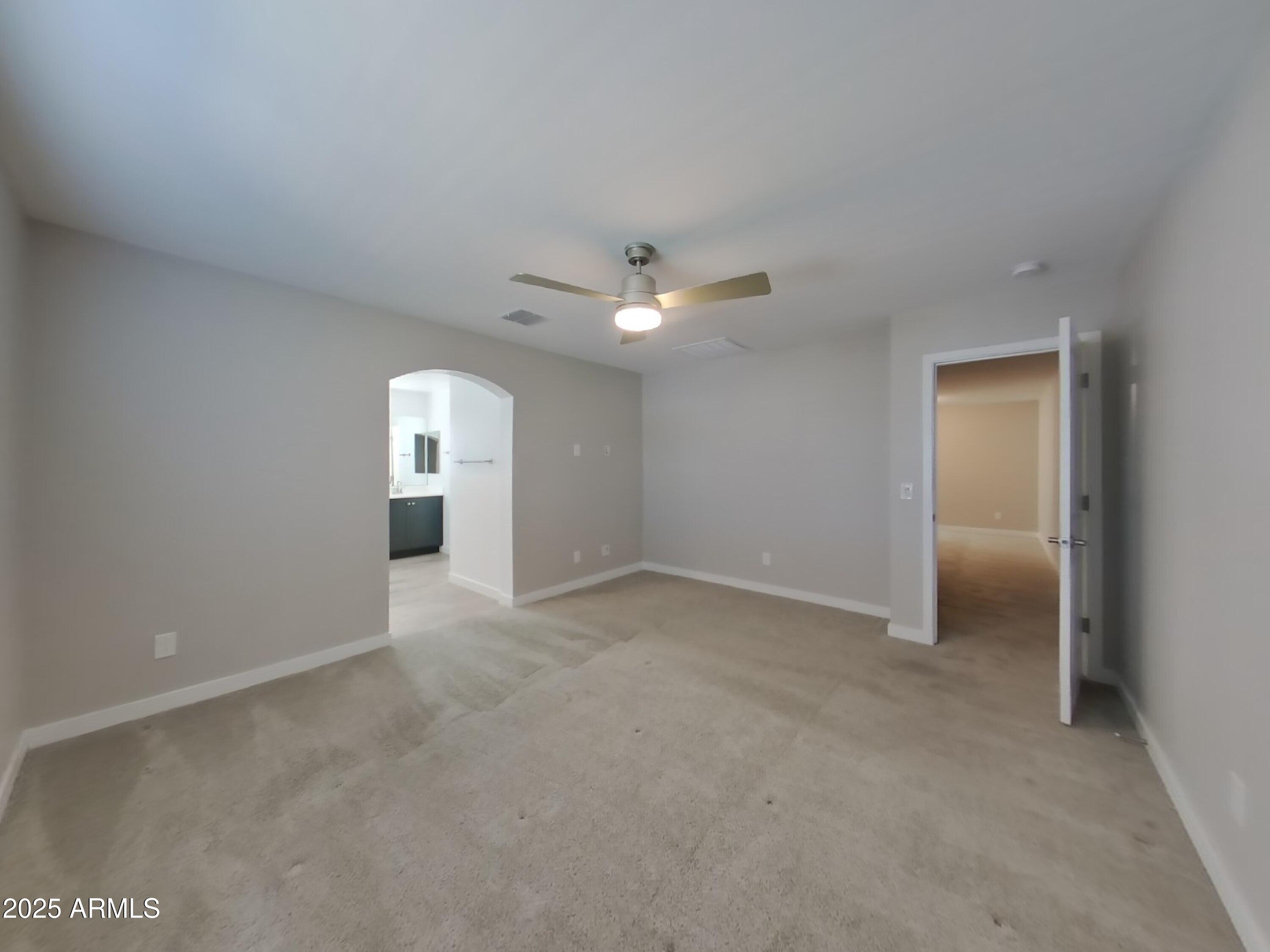9314 East Strobe Avenue Mesa, AZ 85212 - Photo 7 of 27 a view of an empty room with a window