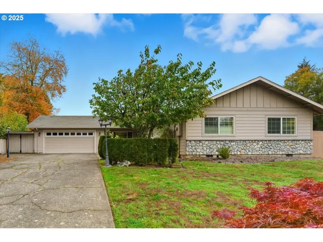 a view of house with backyard