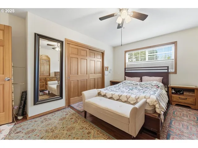 a bedroom with a bed dresser and a window