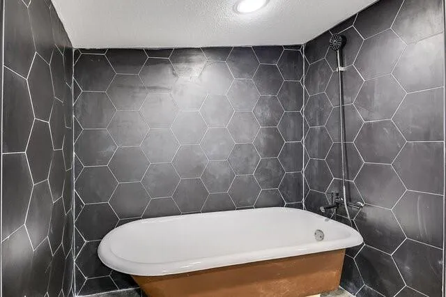 a bathroom with a white toilet and a shower