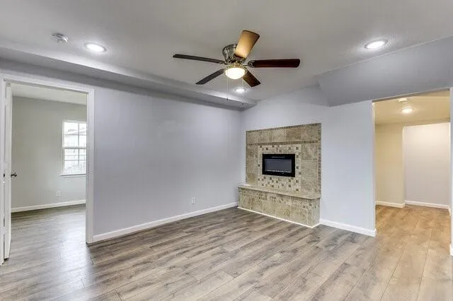 a view of an empty room and wooden floor
