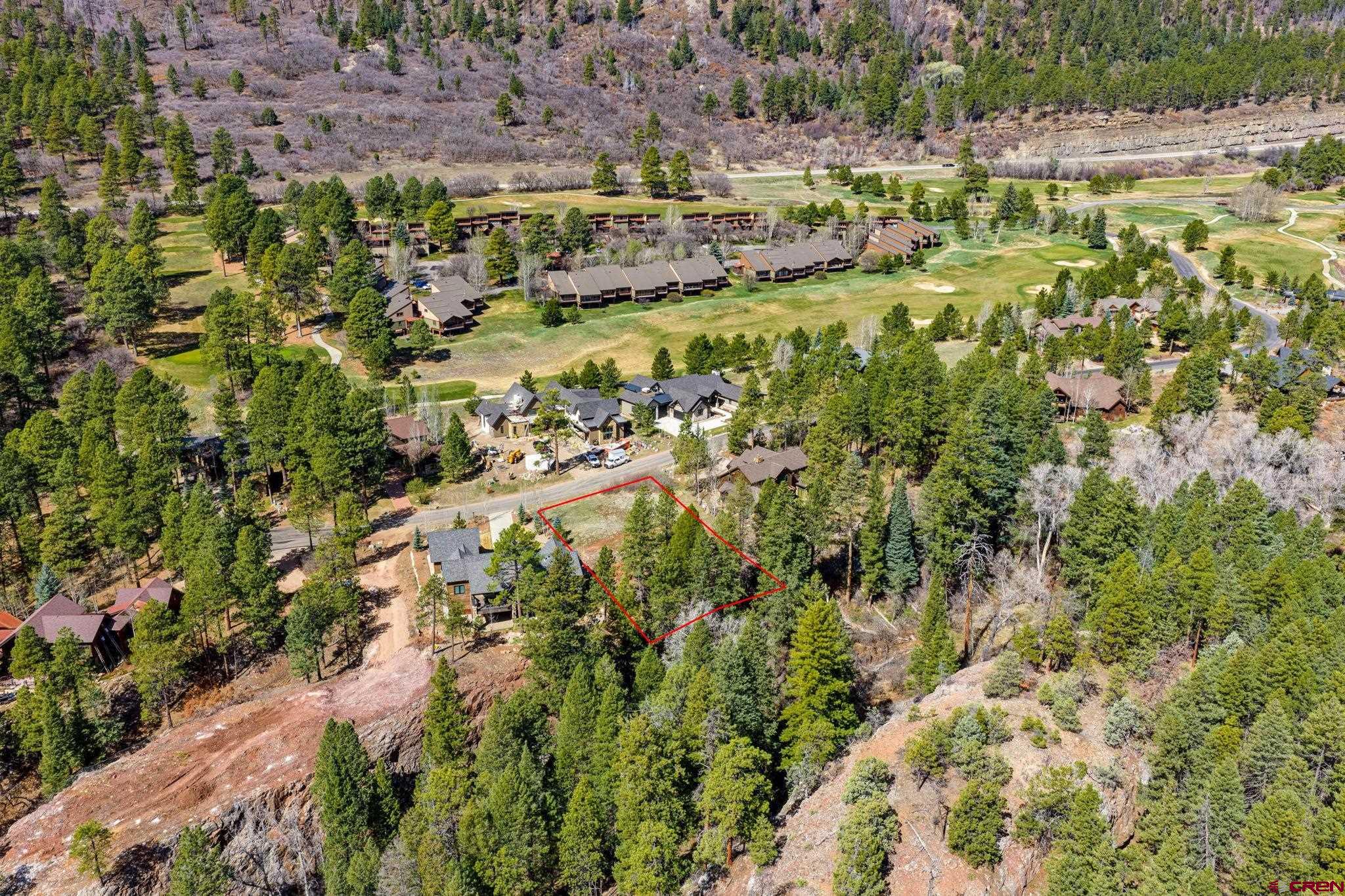 211 Cliffs Edge Drive Durango, CO 81301 - Photo 2 of 24 a view of a yard with plants and large trees