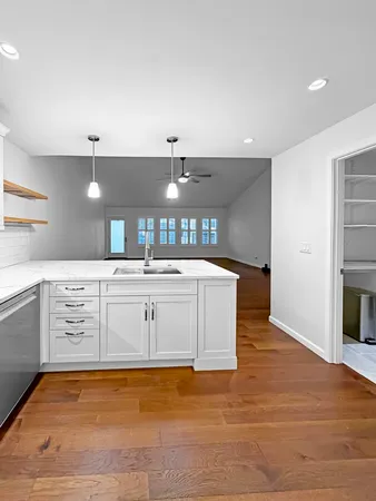 a view of a kitchen with a sink