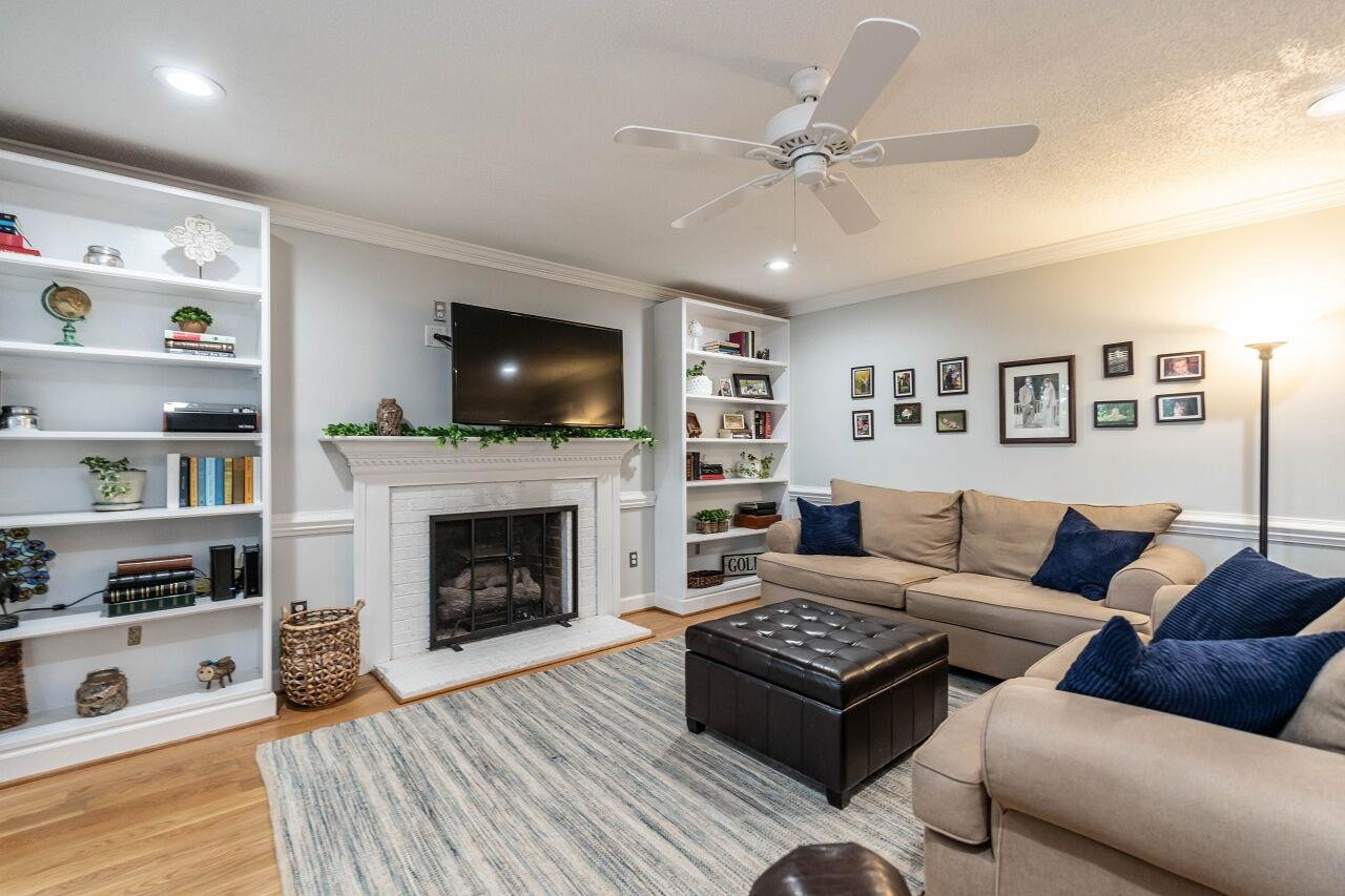 5924 Clearsprings Drive Wake Forest, NC 27587 - Photo 11 of 37 a living room with furniture and a fireplace